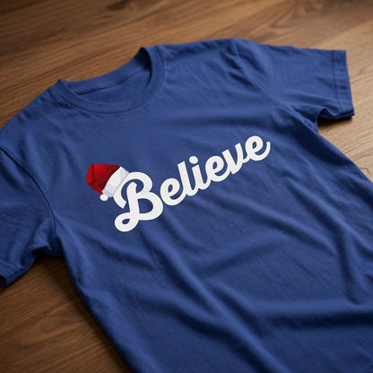 Blue Believe slogan t-shirt with Santa hat on wood, mens fun santa hat christmas text tee