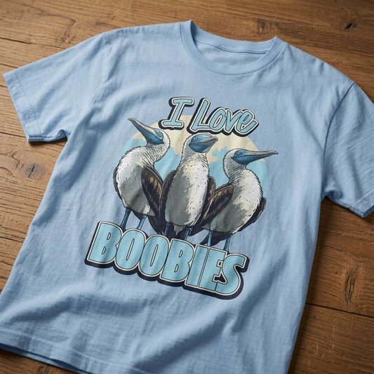 Sky blue I Love Boobies slogan t-shirt on wood, funny witty animal pun graphic mens shirt