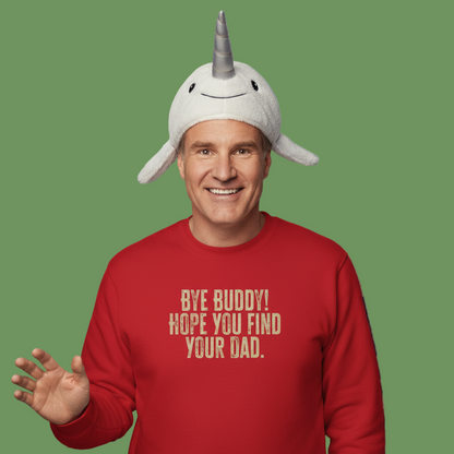 Person wearing a red Elf sweatshirt with humorous Christmas text and a Narwal hat on a green background