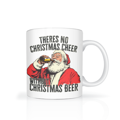 A white Christmas mug features a vintage-style Santa Claus drinking from a beer bottle, with bold text reading, “There’s no Christmas cheer without Christmas beer.” Playful, irreverent holiday humor.