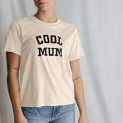 A Woman wearing a beige Mum t-shirt with 