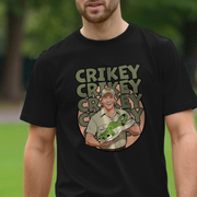 Person wearing a black funny graphic t-shirt with a Steve Irwin inspired graphic design and the repetitive slogan 