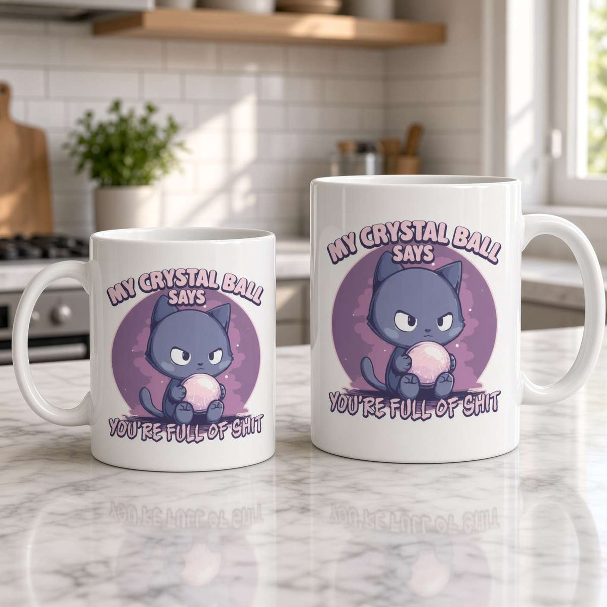 Two white mugs on a sunlit marble kitchen counter feature a grumpy purple cat and the joke, “My crystal ball says you’re full of shit,” creating a cheeky, playful tone.