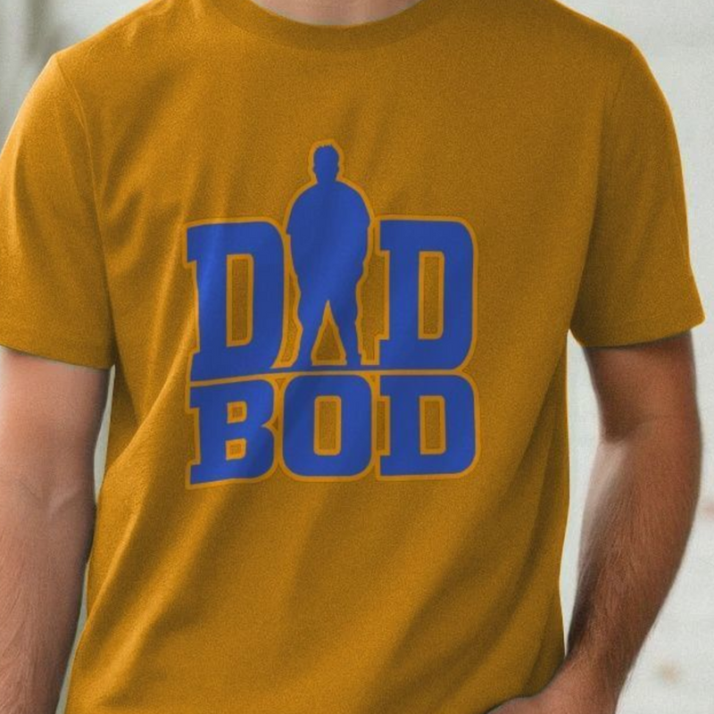 Yellow dad t-shirt with blue 'DAD BOD' graphic on a blurred background