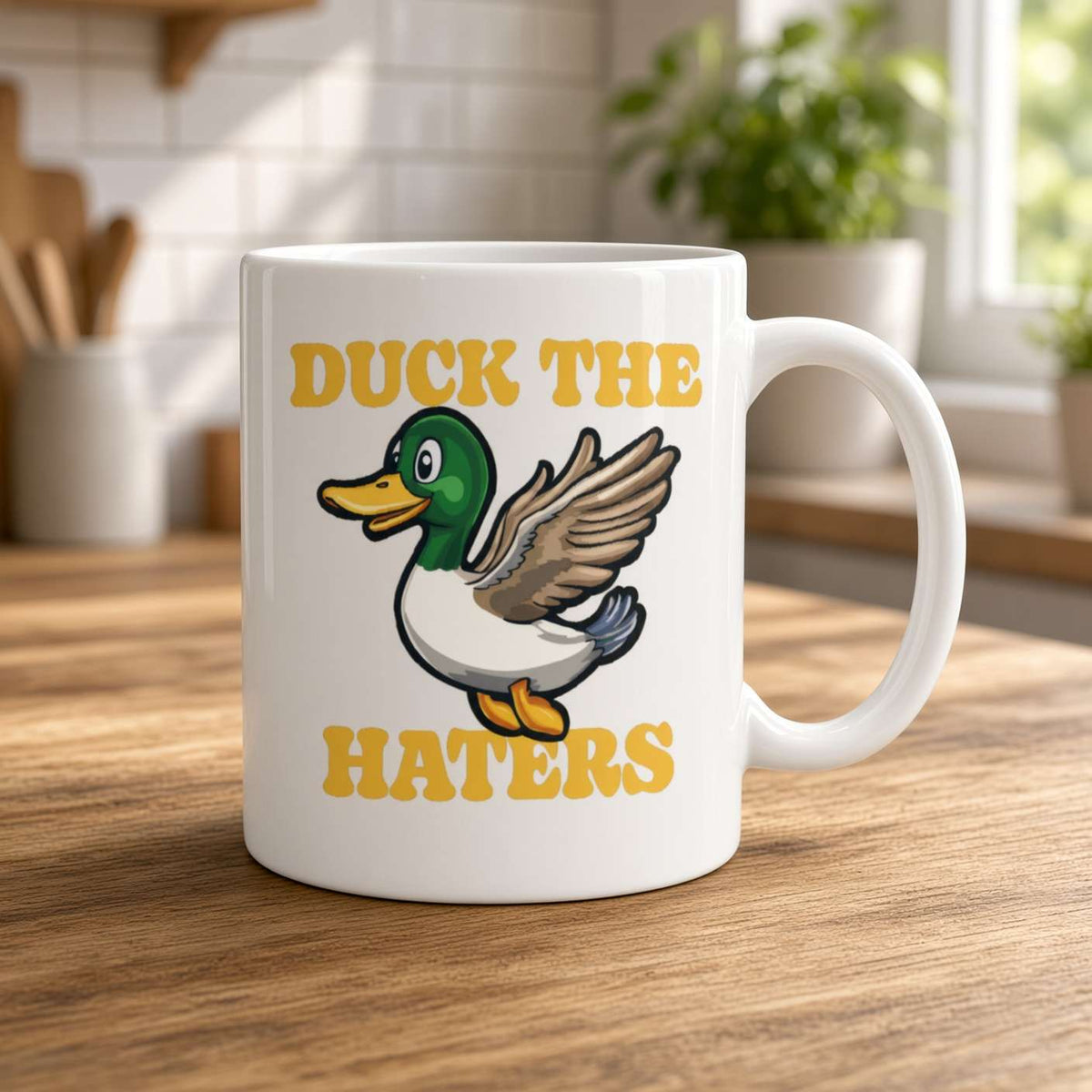 White mug on a sunlit wooden kitchen counter, featuring a cheerful cartoon duck and bold yellow “DUCK THE HATERS” text; playful, upbeat tone.