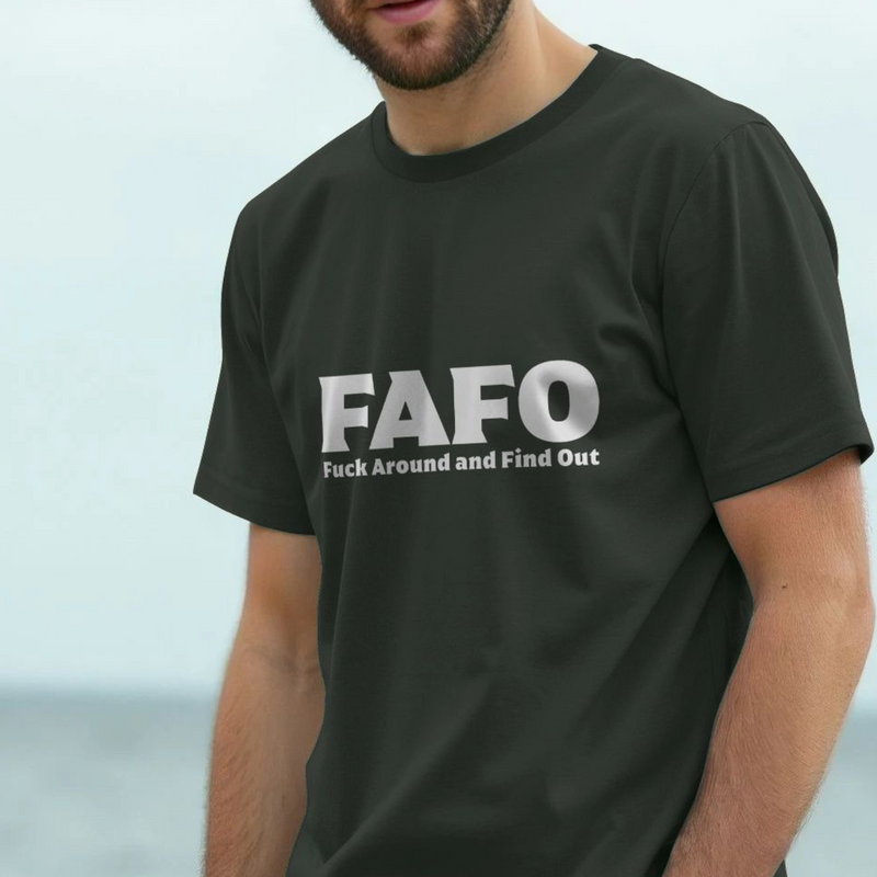 Person wearing a black funny offensive slogan t-shirt with 'FAFO Fuck Around and Find Out' slogan.
