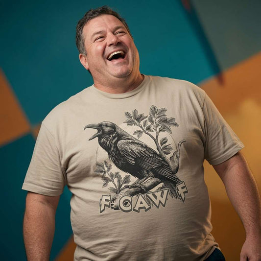 Man laughing while wearing a beige FCAWF t-shirt, cheeky mens offensive rude crow funny viral design full of pure attitude