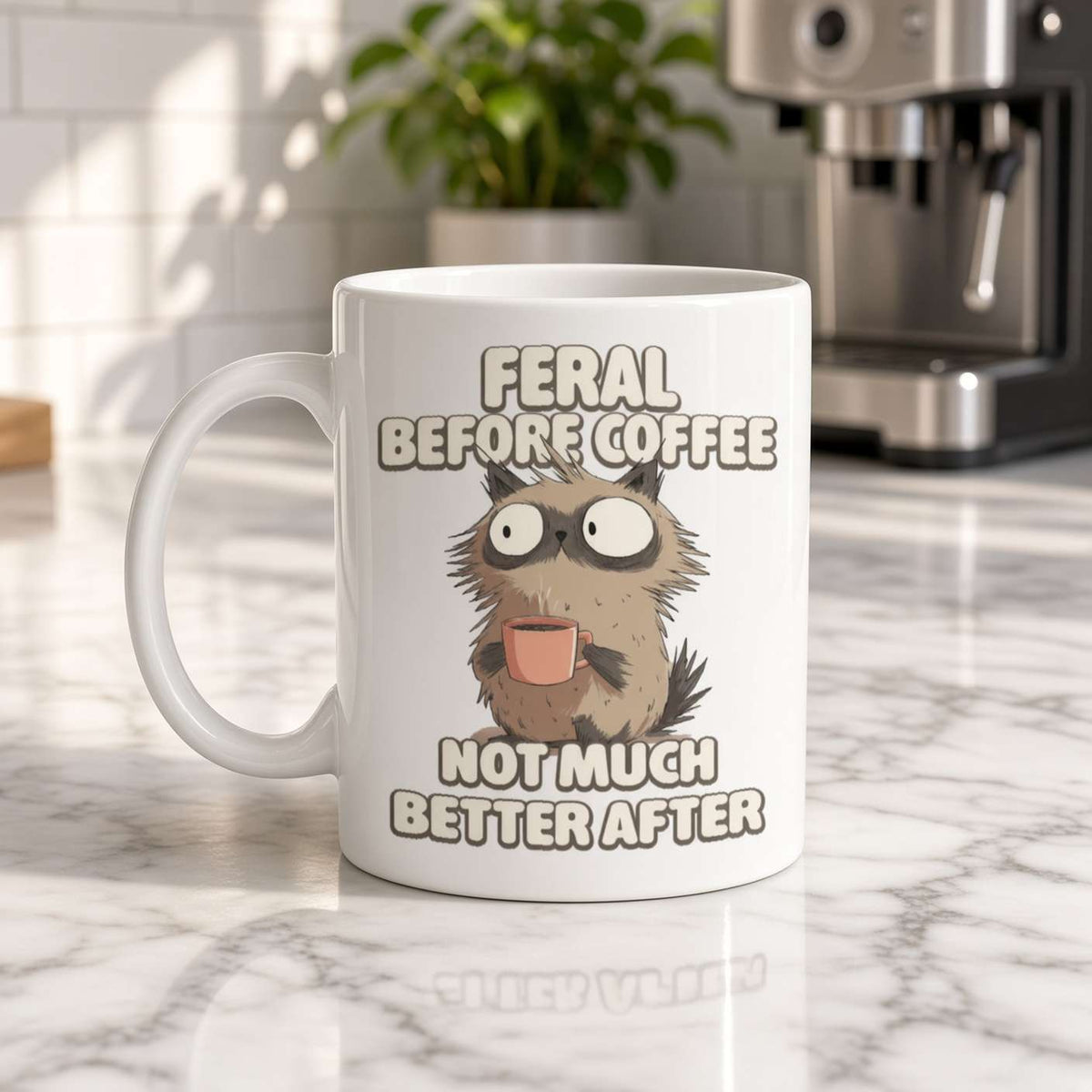 White ceramic coffee mug featuring a frazzled, wide-eyed cat holding a pink cup and the humorous text “Feral before coffee, not much better after.” Playful, relatable tone.