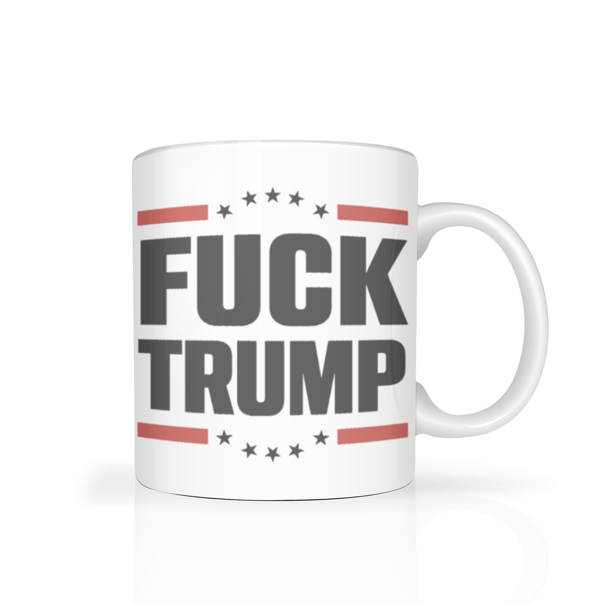 A white mug with a bold political slogan, “FUCK TRUMP,” in dark lettering, framed by red stripes and black stars; it conveys anger and defiance.