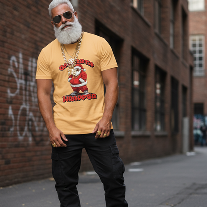 Man wearing a yellow t-shirt with a graphic design of Santa Claus and text, standing against a brick wall.
