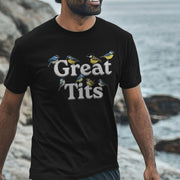 A man wearing a black funny offensive T-shirt with 