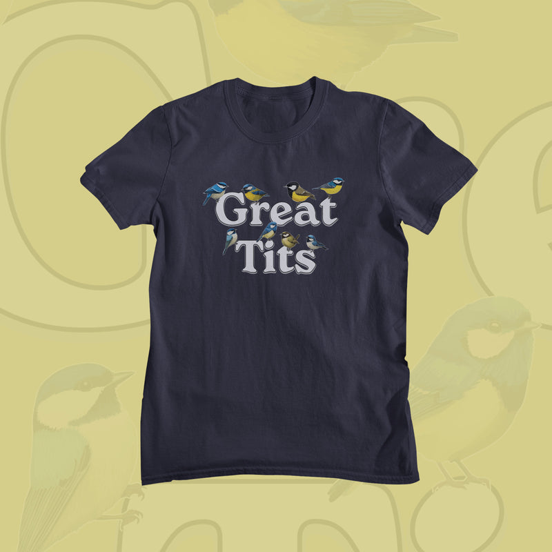 Navy blue Funny T-shirt displaying the words "Great Tits" adorned with colorful bird illustrations above a light yellow background featuring subtle bird graphics.