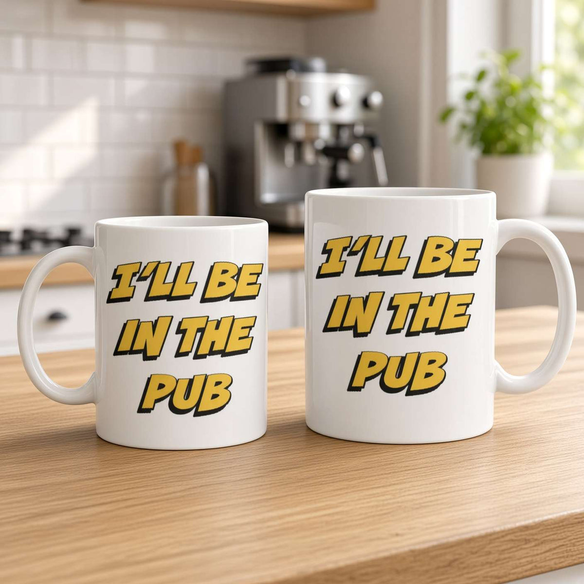 White mug of latte art on a wooden desk reads “I’ll be in the pub,” beside a laptop, notebook, and small succulent; bright, relaxed workspace scene.
