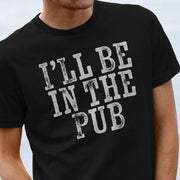 Close-up of a man wearing a black funny old man T-shirt with bold white text reading 