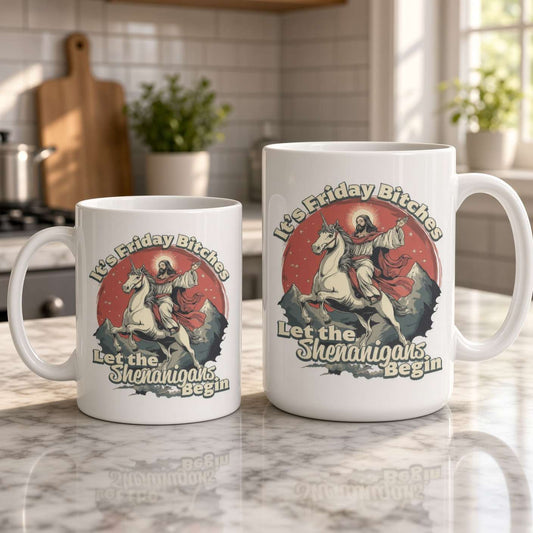 Two white mugs on a sunlit marble counter feature a vintage-style horse and rider with the playful slogan “Let the Shenanigans Begin,” creating a cheerful kitchen scene.