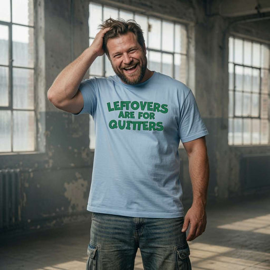 Man laughing scratching head in sky blue Leftovers Are for Quitters t-shirt, funny witty mens xmas day tales slogan
