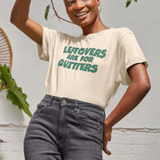 Smiling Woman wearing a beige Relaxed Fit Christmas t-shirt with green text, 