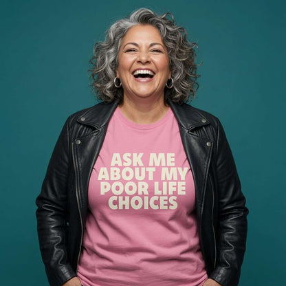 Woman laughing with a black leather jacket over her shoulders while wearing a pink Ask Me About My Poor Life Choices t-shirt, funny witty relatable ladies statement design full of pure attitude