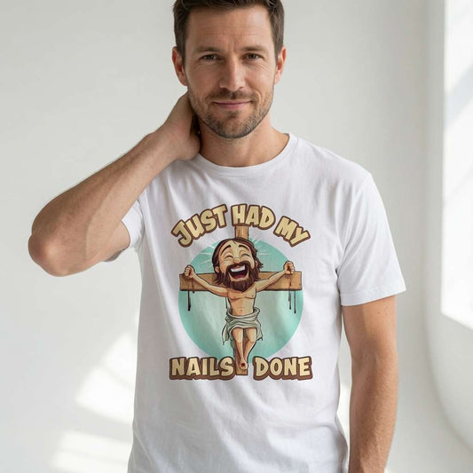 Man smiling with hand on neck in white Just Had My Nails Done t-shirt featuring laughing Jesus on cross, funny jesus joke offensive