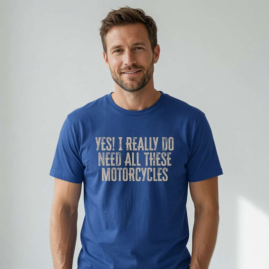 Bearded man smiling confidently in a bright blue Yes! I Really Do Need All These Motorcycles t-shirt, fun and witty statement for motorcycle enthusiasts