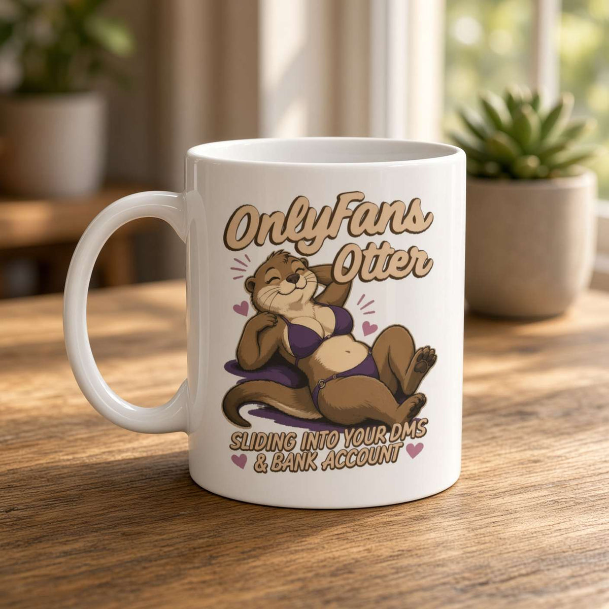 A white mug on a sunlit wooden table features a reclining otter and playful “OnlyFans Otter” slogan, with houseplants softly blurred behind it.