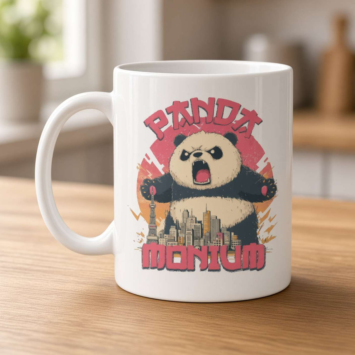 A white ceramic mug on a wooden table shows an angry panda towering over a city, with bold red “Panda Monium” lettering; playful, action-packed design.