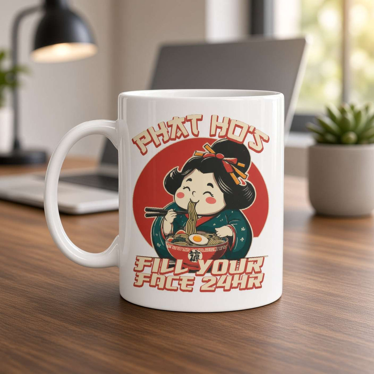 A white mug on a wooden desk shows a cheerful cartoon girl eating noodles, with the slogan “That hot fills your face 24hr”; cozy workspace in soft light.