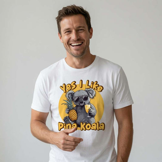 Man smiling while wearing a white Yes I Like Pina Koala t-shirt featuring a cool koala in sunglasses holding a pineapple and cocktail, fun and witty cute kawaii animal graphic