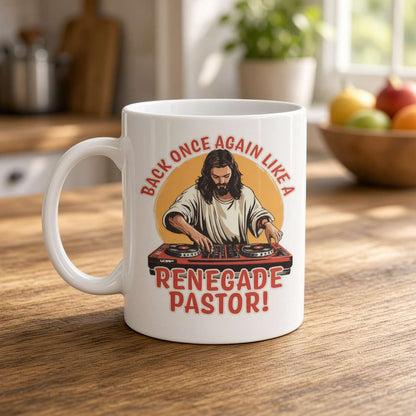 White mug on a sunlit kitchen counter features a bearded pastor DJ at turntables and the slogan “Back once again like a renegade pastor!” Playful, retro design.