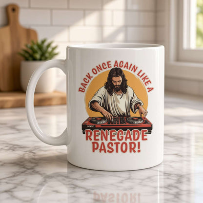 White mug featuring a bearded pastor DJ at turntables and the slogan “Back once again like a renegade pastor!” in a bright kitchen.