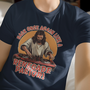 A man wearing a navy Music T-shirt featuring an illustration of Jesus as a DJ at turntables. Text reads, 