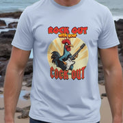 Man wearing a light blue funny T-shirt featuring a cartoon rooster playing an electric guitar, with text 