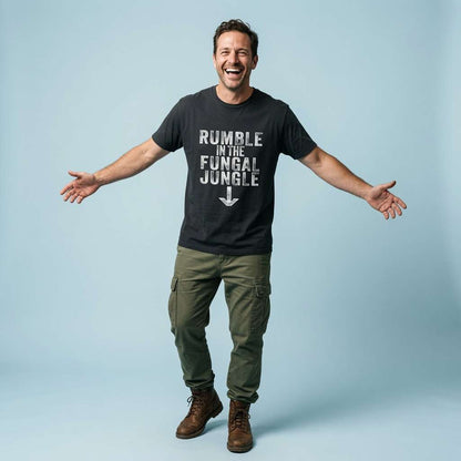 Man laughing with arms outstretched while wearing a black Rumble in the Fungal Jungle t-shirt, funny and cheeky mildly offensive mens slogan full of pure attitude
