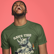 A man laughing with his head tilted back, wearing a green Funny Graphic T-shirt featuring a rhino and a bottle. The text reads 