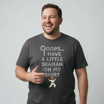 Man laughing and giving a thumbs up while wearing a khaki Ooops.. I Have a Little Seaman on My Shirt t-shirt with a tiny cartoon sailor, offensive and witty mens rude sailor design