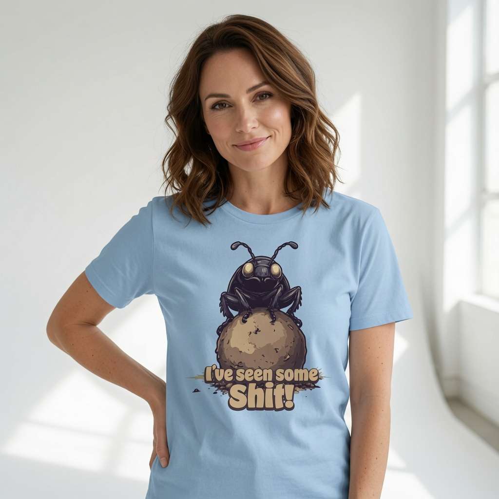 Woman smiling with one hand on her hip while wearing a blue I’ve seen some Shit! t-shirt with the full dung beetle graphic, funny insect pun full of pure attitude