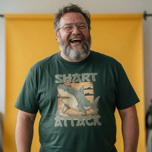 Man laughing while wearing a glazed green Shart Attack t-shirt, fun mens shark graphic design that every cheeky lad will claim