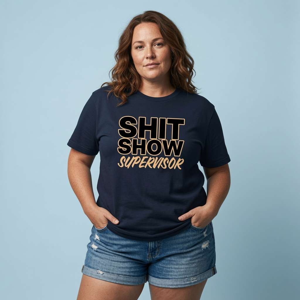 Woman standing with hands in her pockets while wearing a navy Shit Show Supervisor t-shirt, funny and relatable ladies quote full of pure attitude