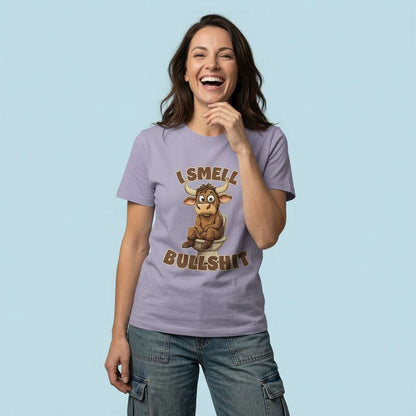 Woman laughing with a hand near her face in a lavender I Smell Bullshit t-shirt, funny and cheeky rude bull pun that every no-nonsense lady will claim