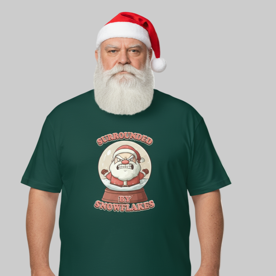 Father Christmas wearing a green Santat-shirt with a Christmas-themed snow globe graphic and Santa hat on a gray background
