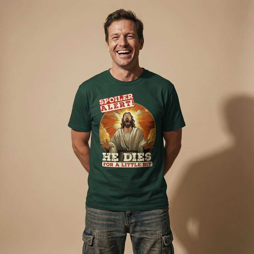 Man laughing in a bottle green Spoiler Alert! He Dies for a Little Bit t-shirt, funny and rude offensive Jesus graphic that every cheeky lad will claim