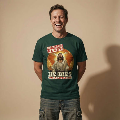 Man laughing in a bottle green Spoiler Alert! He Dies for a Little Bit t-shirt, funny and rude offensive Jesus graphic that every cheeky lad will claim