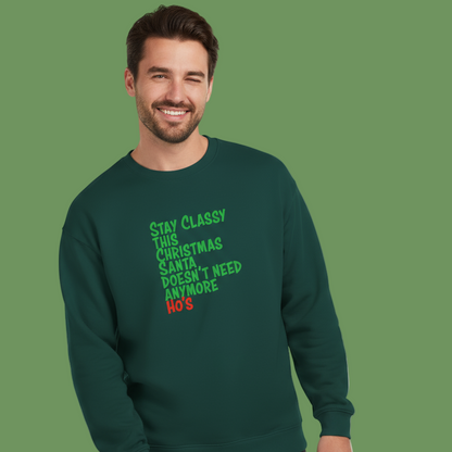 Man wearing a green Christmas slogan sweatshirt with humorous text on a green background