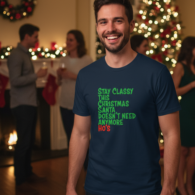Man wearing a navy blue funny Christmas t-shirt with humorous Christmas text in a festive indoor setting.