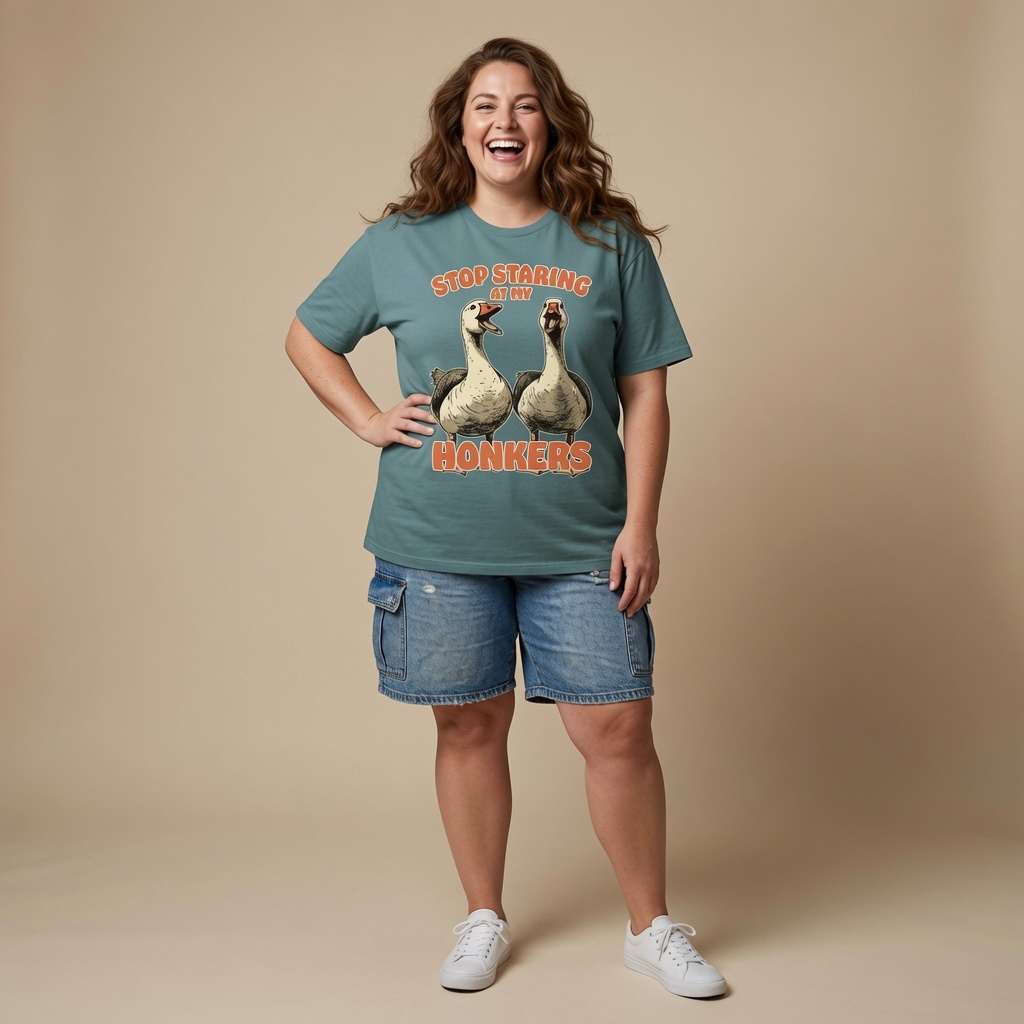 Woman laughing with one hand on her hip in a green bay Stop Staring at My Honkers t-shirt, funny and cheeky ladies animal graphic full of pure attitude
