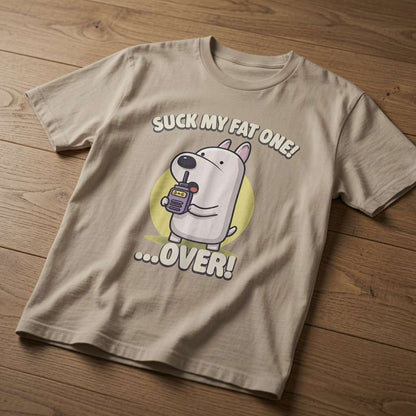 Stone Suck My Fat One! …Over! t-shirt laid flat on a wooden surface showing the full cartoon dog graphic, cheeky and fun mens rude dog design that every cheeky lad will claim