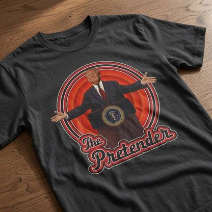 Black The Pretender t-shirt laid flat on a wooden surface showing the full Trump podium graphic, funny political satire tee that every cheeky lad will claim