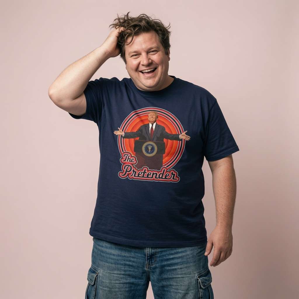 Man laughing with one hand in his hair while wearing a navy The Pretender t-shirt featuring a Trump podium graphic, political satire design