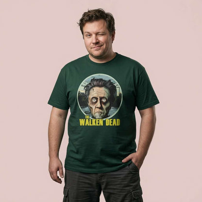 Man winking with one hand in his pocket while wearing a green The Walken Dead t-shirt, mens fun zombie walker pun design full of pure attitude