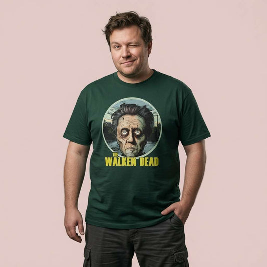 Man winking with one hand in his pocket while wearing a green The Walken Dead t-shirt, mens fun zombie walker pun design full of pure attitude